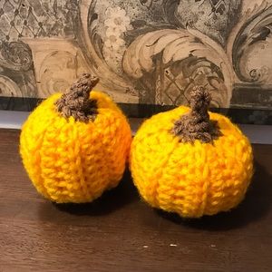 2 Mini crochet pumpkins.
